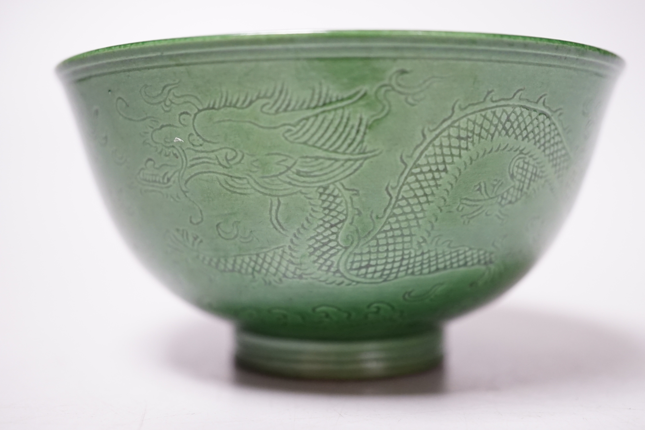 A Chinese green glazed ‘dragon’ tea bowl, 10cm diameter